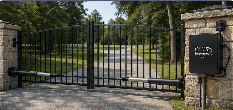 Rendered residential driveway gate with OSM control mounted beside the gate